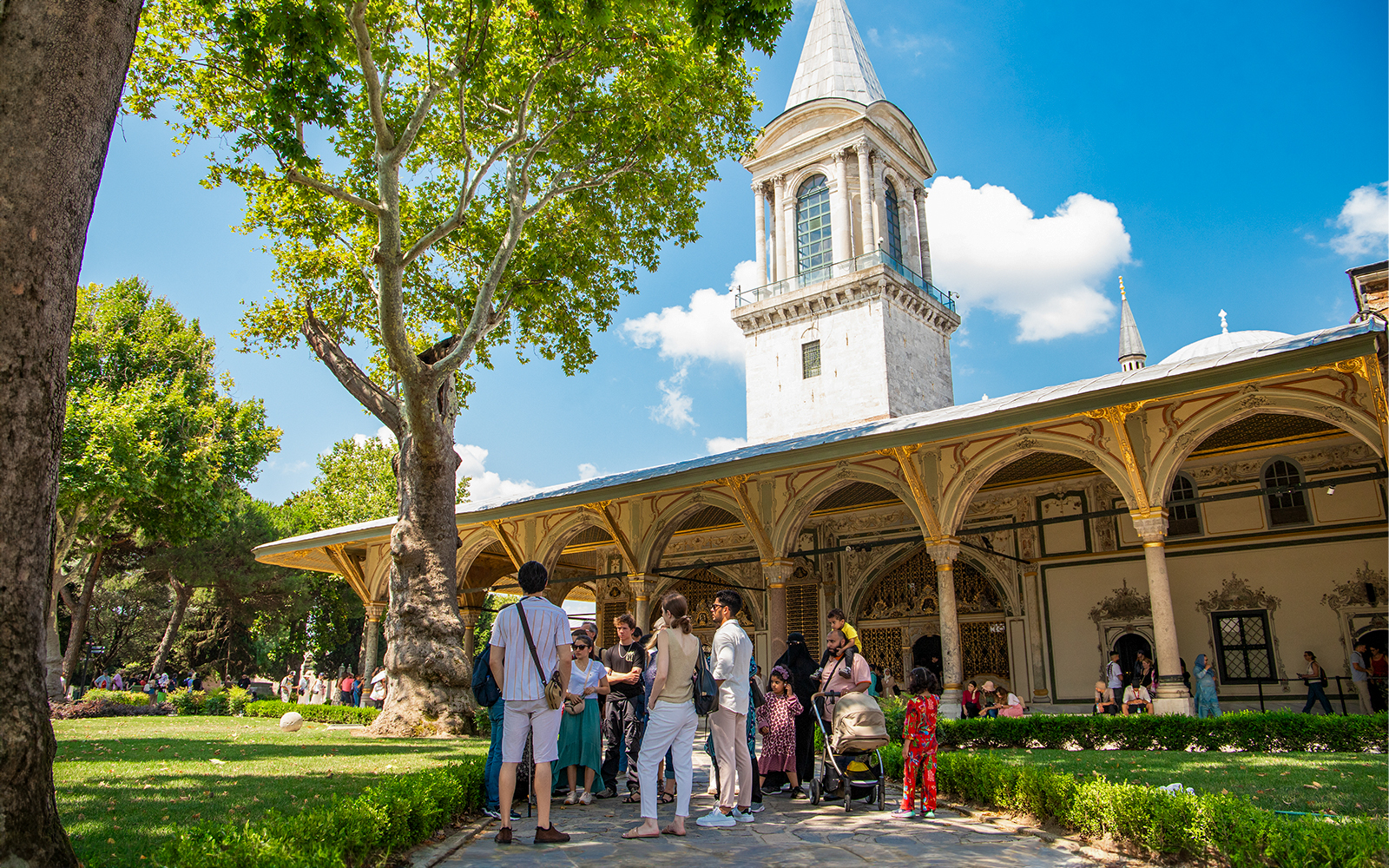 Tourists exploring the courtyard of Topkapi Palace, Istanbul.