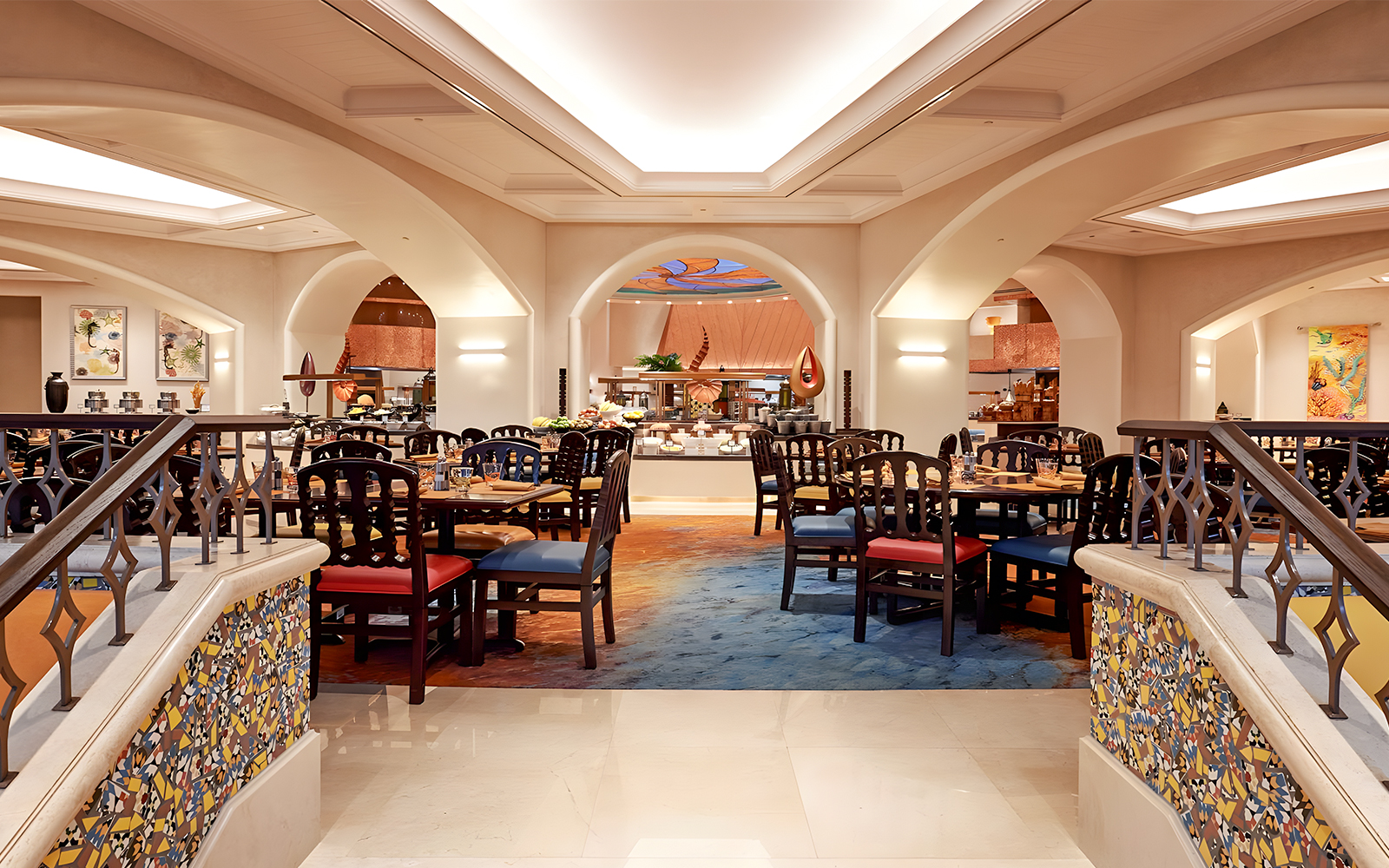 Dining area at Kaleidoscope restaurant, Atlantis Dubai, featuring elegant seating and buffet setup.