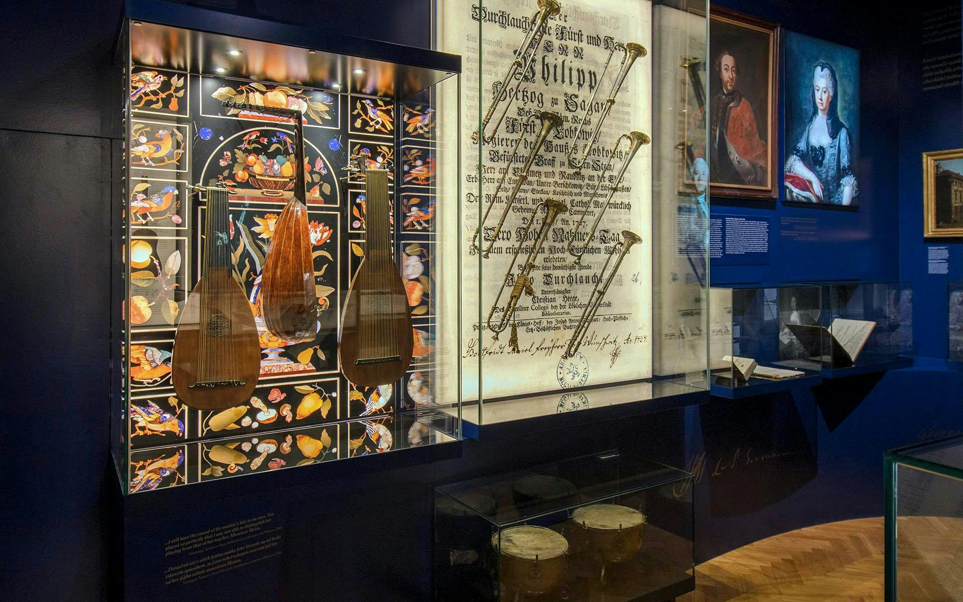 Musical instruments and historical documents displayed at Lobkowicz Palace Museum, Prague.