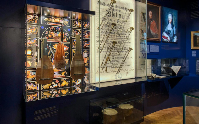 Musical instruments and historical documents displayed at Lobkowicz Palace Museum, Prague.