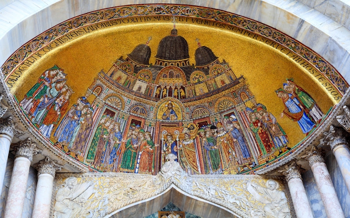 Mosaic detail of St Mark's Basilica in Venice, featuring religious figures and intricate designs.