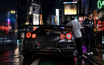 Nissan GT-R parked on Tokyo street during JDM culture tour with Liberty Walk and Daikoku PA.