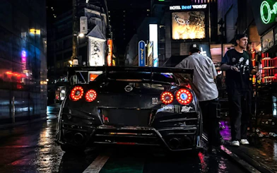 Nissan GT-R parked on Tokyo street during JDM culture tour with Liberty Walk and Daikoku PA.