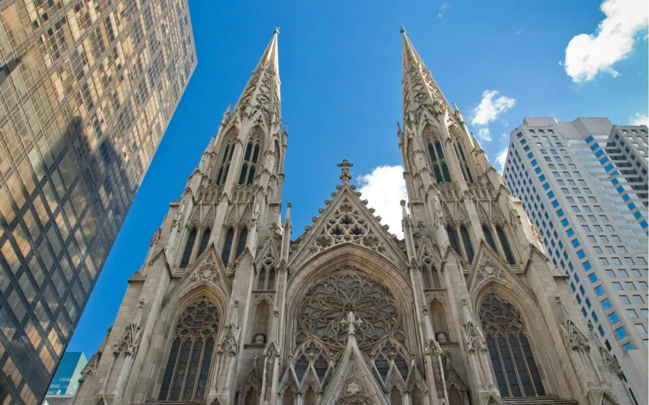 St. Patrick's Cathedral facade between skyscrapers, part of Secret Societies of Manhattan tour, New York.