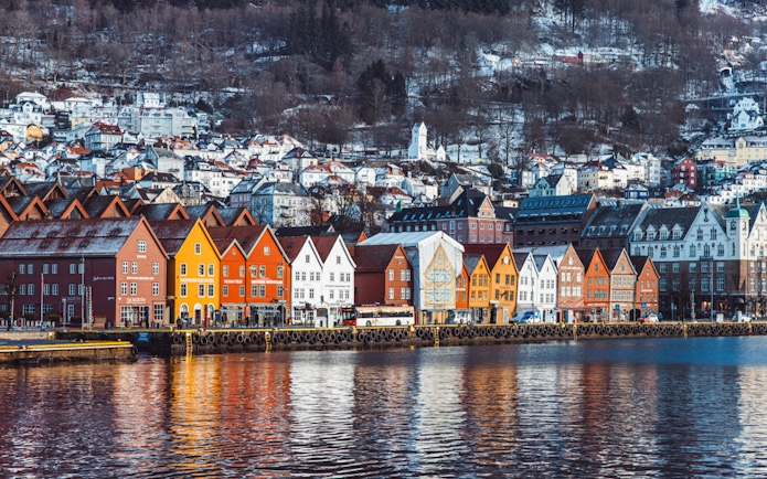 Colorful wooden houses along Bergen's waterfront, seen from the Mostraumen Fjord Cruise.