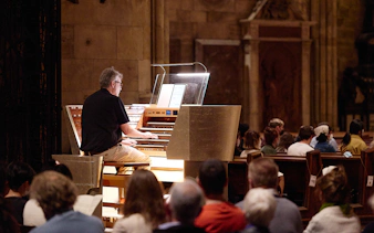 Organist performing at St. Stephen's Cathedral concert, Vienna.