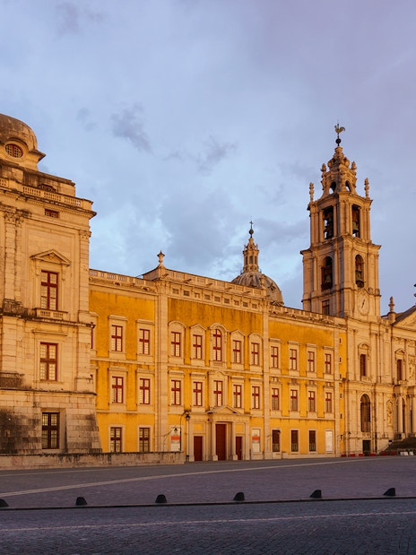 National Palace of Mafra facade at sunset, Portugal.