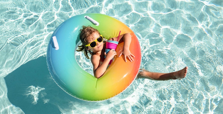 Afamosa Malacca water park with colorful slides and pools, visitors enjoying attractions.