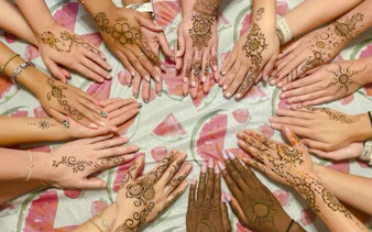 Henna designs on hands at Essaouira Craft Complex workshop, Essaouira.