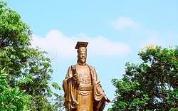 Statue of Confucius surrounded by trees in Hanoi Old Quarter.