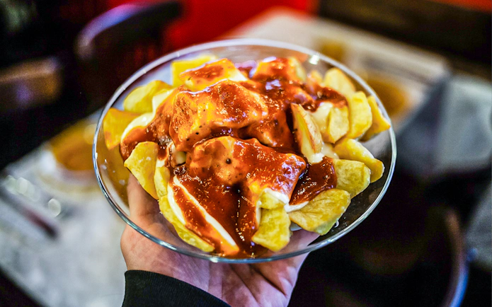 Patatas bravas served on a 3-hour guided food tour in La Barceloneta, Barcelona.