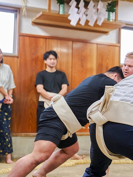 Sumo wrestlers practicing in a Koto City dojo.