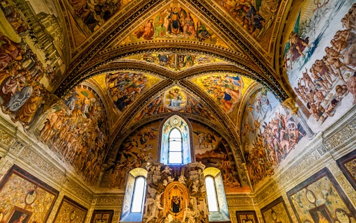 Frescoes on the ceiling of Chapel of San Brizio, depicting religious scenes and figures.