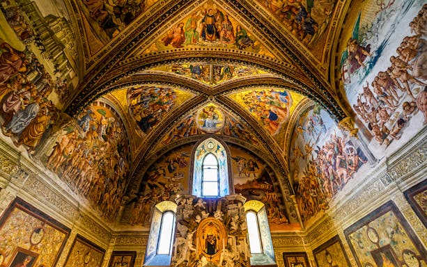 Frescoes on the ceiling of Chapel of San Brizio, depicting religious scenes and figures.