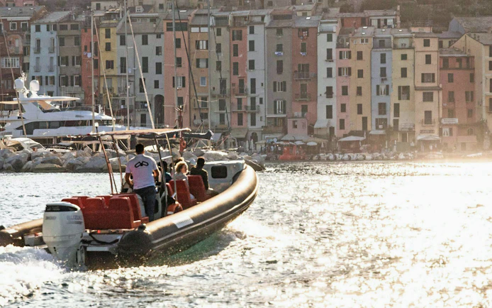 Boat approaching colorful buildings in Portovenere, La Spezia, during a 3 Islands trip.