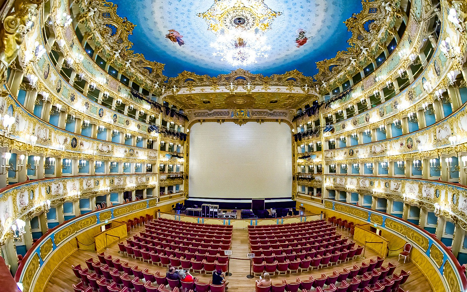 Fenice Theater interior with ornate balconies and stage, Venice, Italy.