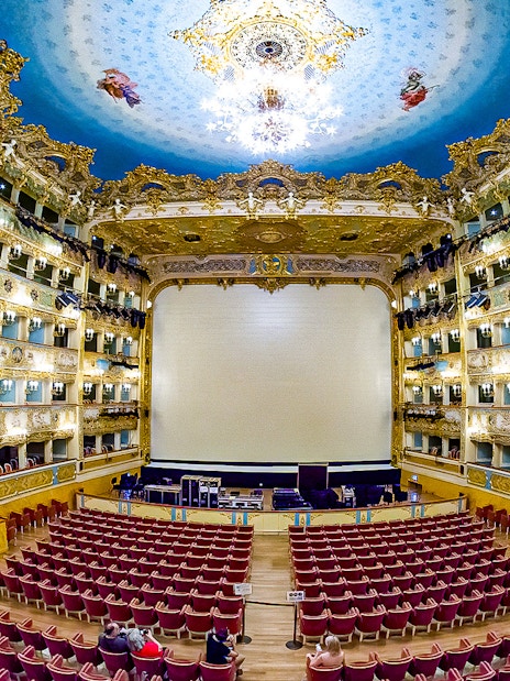 Fenice Theater interior with ornate balconies and stage, Venice, Italy.