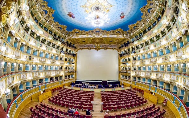 Fenice Theater interior with ornate balconies and stage, Venice, Italy.