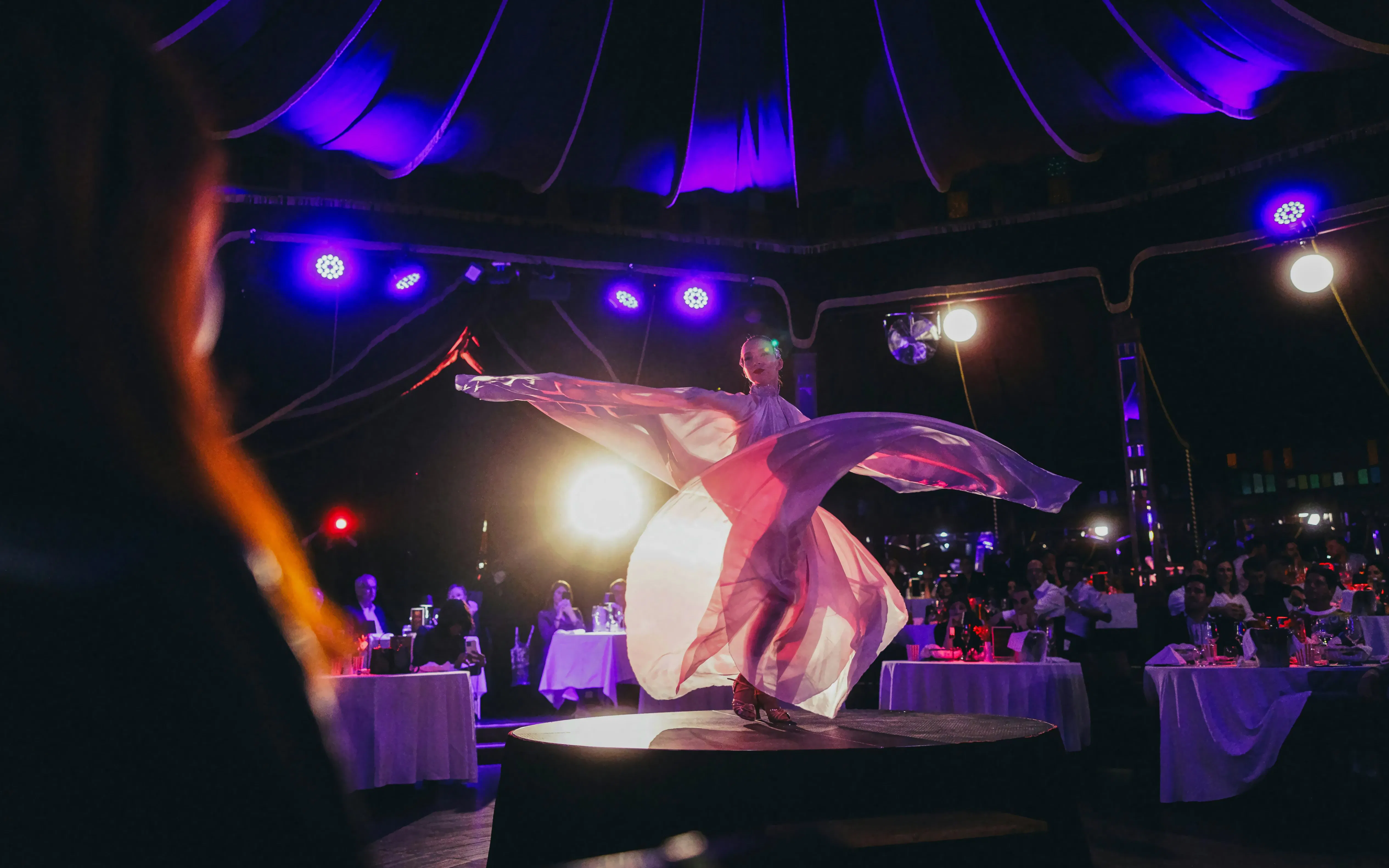 Performer on stage at The Mirage dinner show, Burlesque, Vienna.