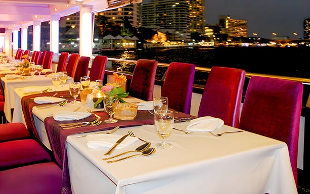 Dining setup on Chao Phraya Valentine's Day Dinner Cruise at Asiatique Riverfront, Bangkok.