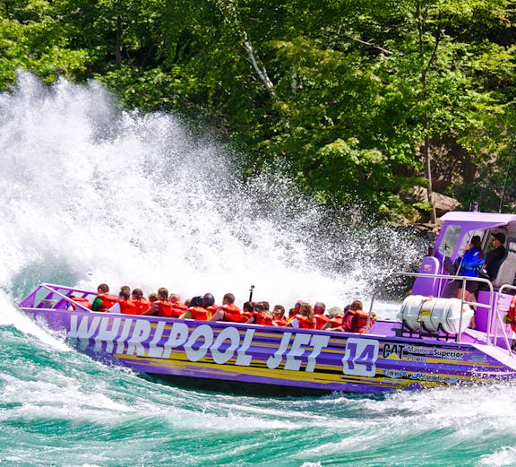 Guests enjoying Whirlpool Jet Boat Tour in Niagara Gorge, Canada.