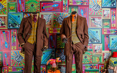 Weasley twins' suits and joke products at the magical mischief exhibit, Harry Potter London tour.