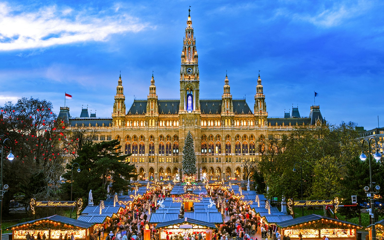 Vienna Christmas Market at Rathausplatz with festive lights and stalls.