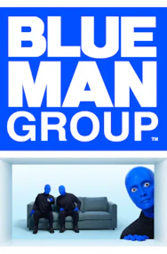 Blue Man Group performing on stage with vibrant lights in New York City.