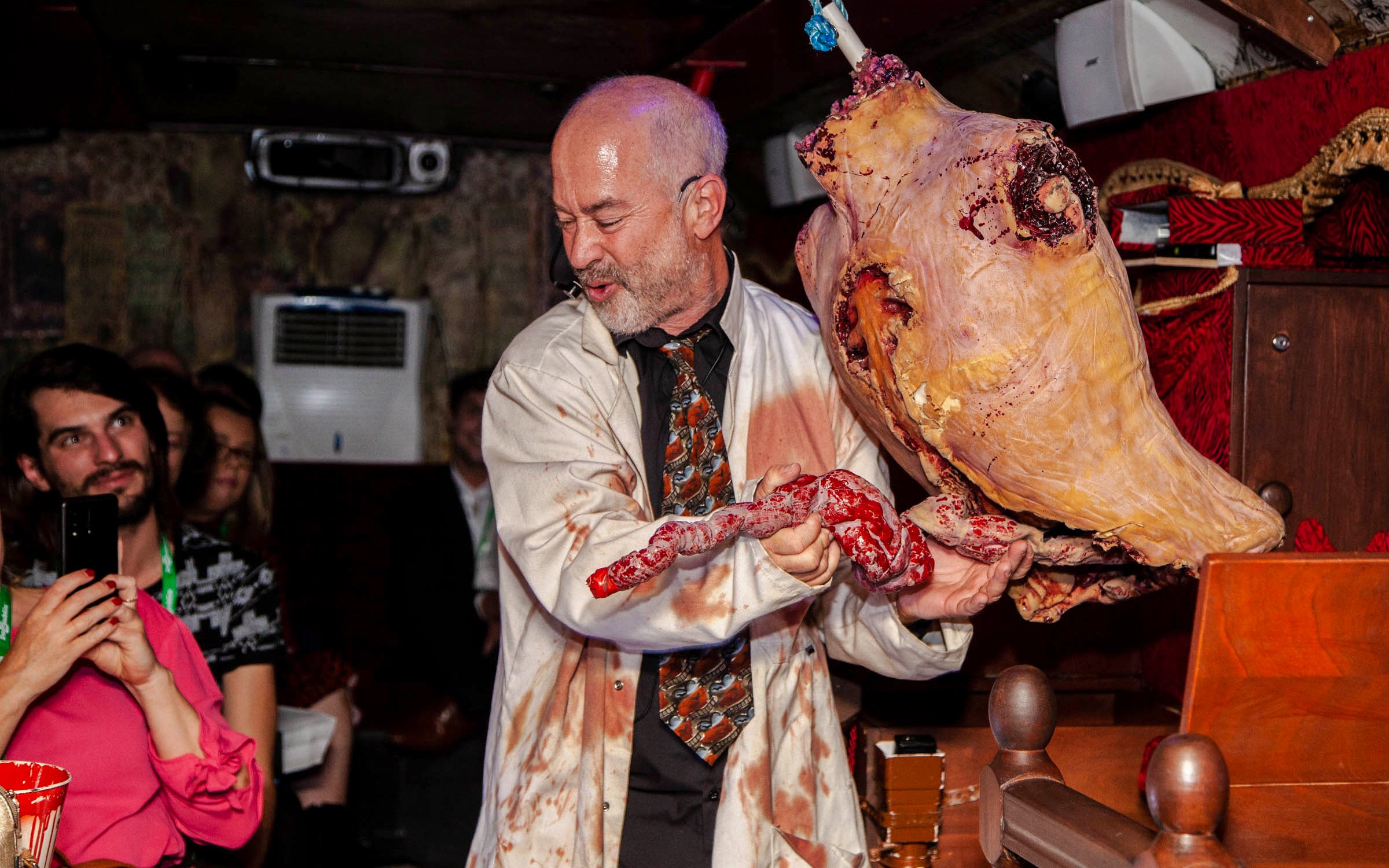 Man performing theatrical horror scene on Dublin Ghostbus Tour.