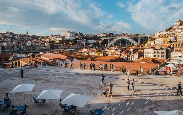 Terrace view of Porto with Dom Luís I Bridge in WOW Porto Cultural District.