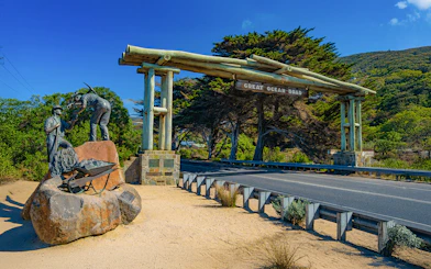 Great Ocean Road entrance with war memorial statue of workers in Australia.