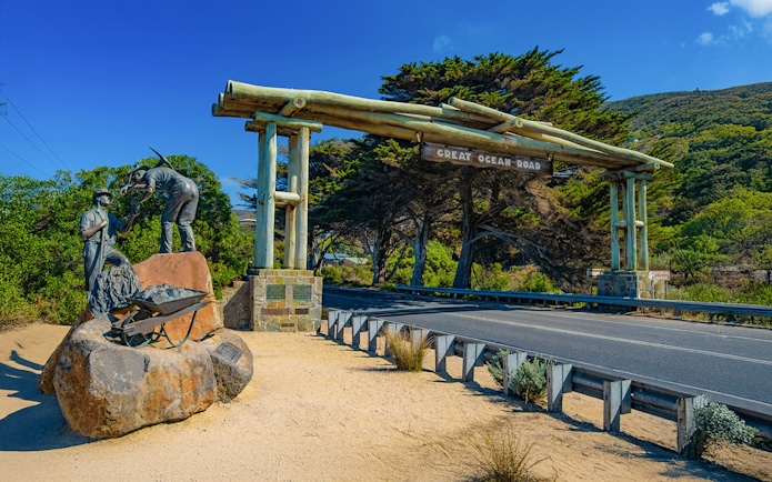 Great Ocean Road entrance with war memorial statue of workers in Australia.