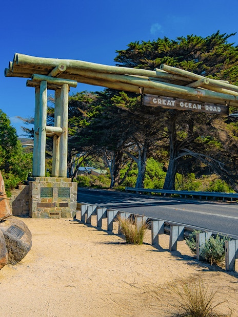 Great Ocean Road entrance with war memorial statue of workers in Australia.