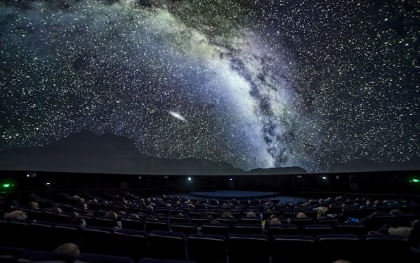 Planetarium show at Cité des Sciences et de l'Industrie, Paris, with starry sky projection.