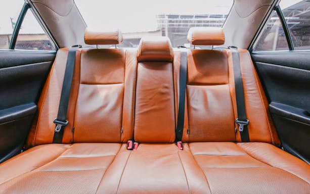Backseat of a private car for transfer from Suvarnabhumi Airport, Bangkok.
