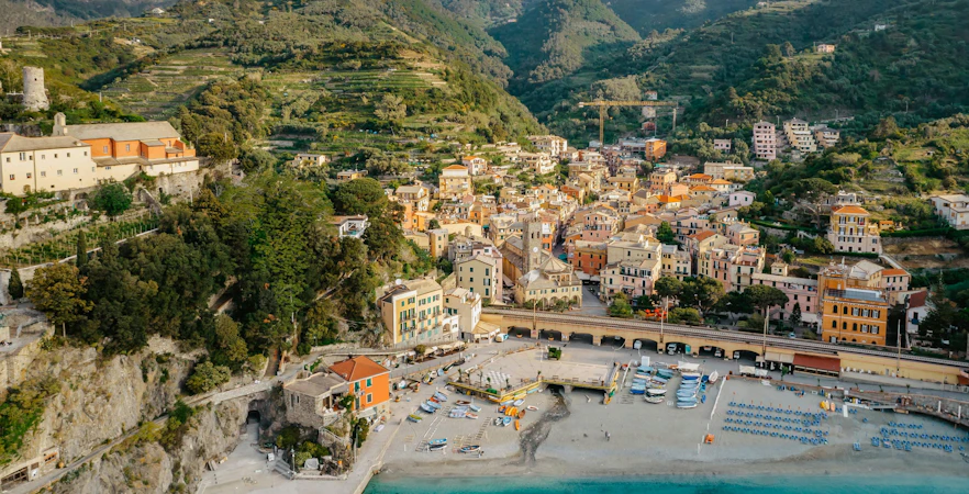 Aerial view of Monterosso village and coastline, Cinque Terre, Italy, with Torre Aurora.