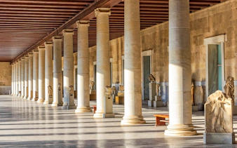 National Archaeological Museum Athens interior with ancient sculptures and columns.