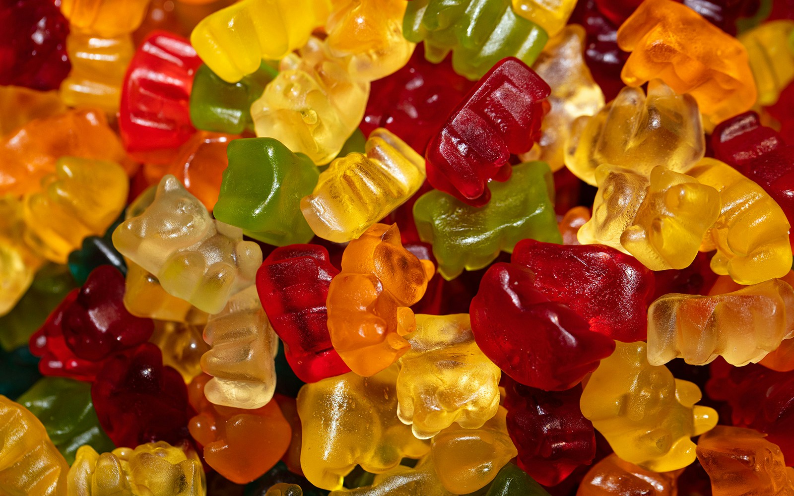 Honey Bear jelly candies in a colorful assortment on display in a candy shop.
