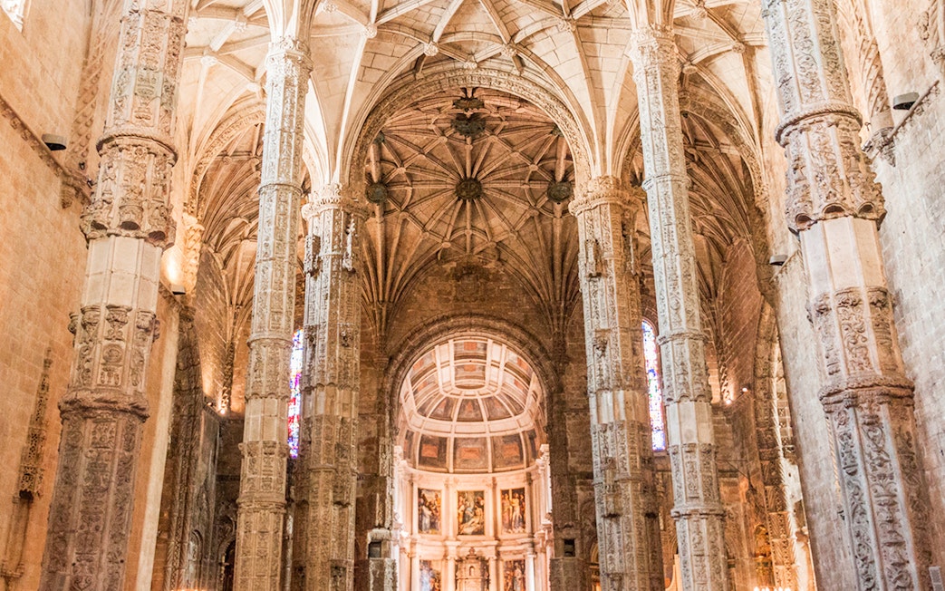 Jeronimos Monastery ornate interior with detailed columns, Lisbon, Portugal.