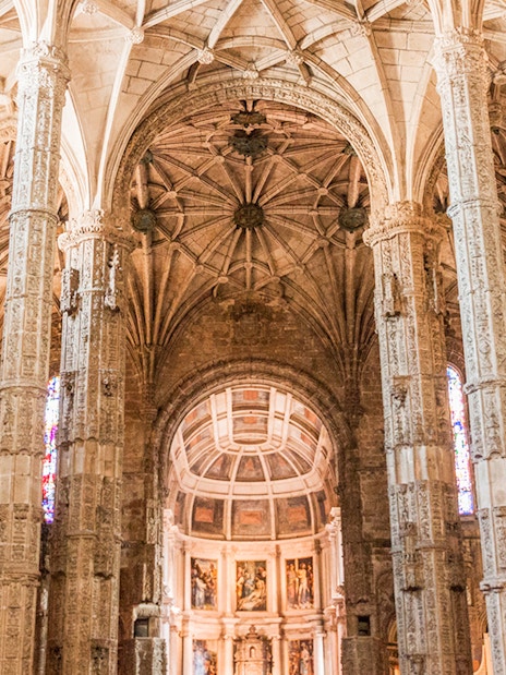 Jeronimos Monastery ornate interior with detailed columns, Lisbon, Portugal.