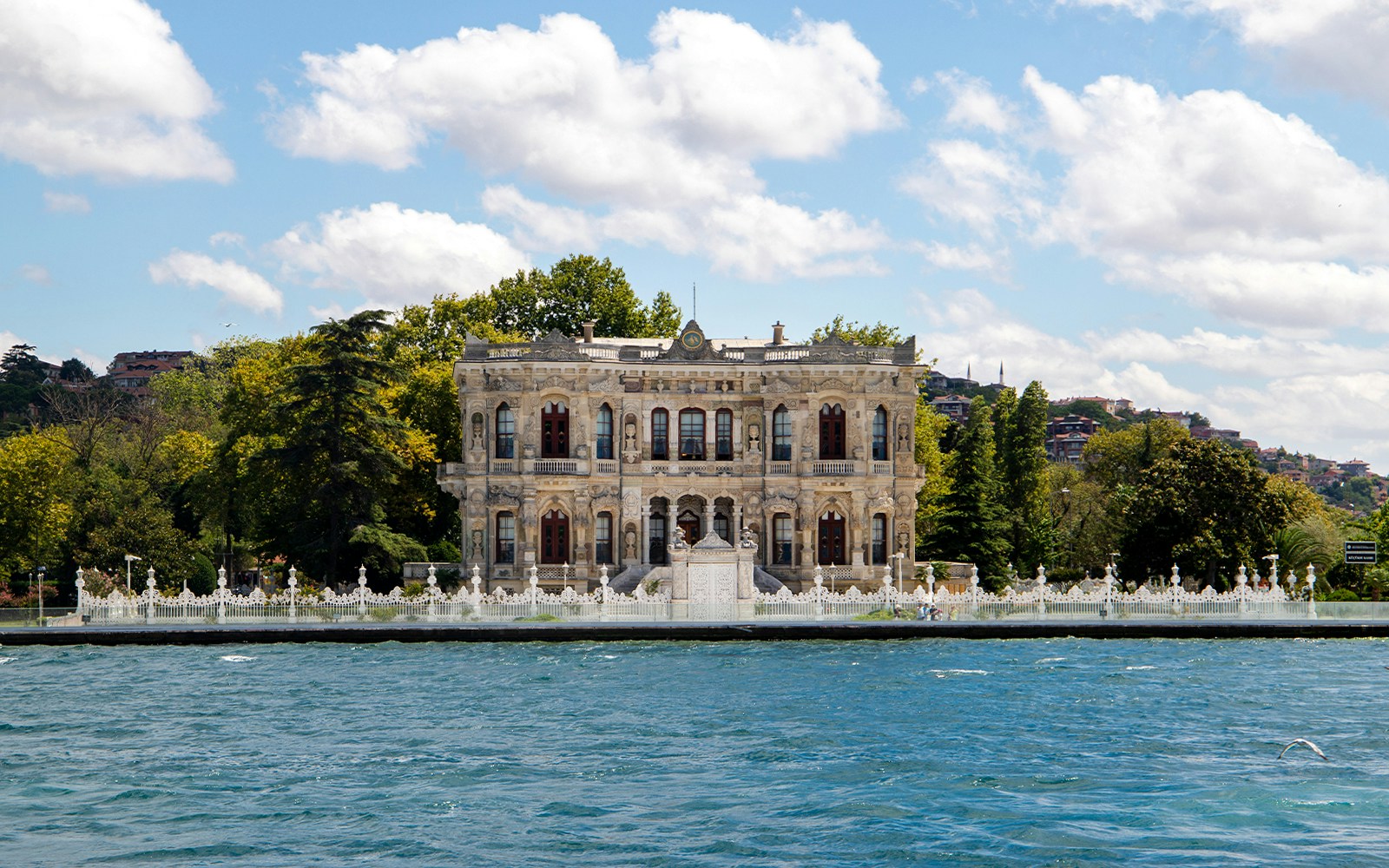 Bosphorus cruise ship sailing past Istanbul skyline with audio guide.