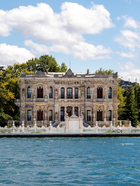 Kksu Pavilion by the Bosphorus in Istanbul, surrounded by trees and water.