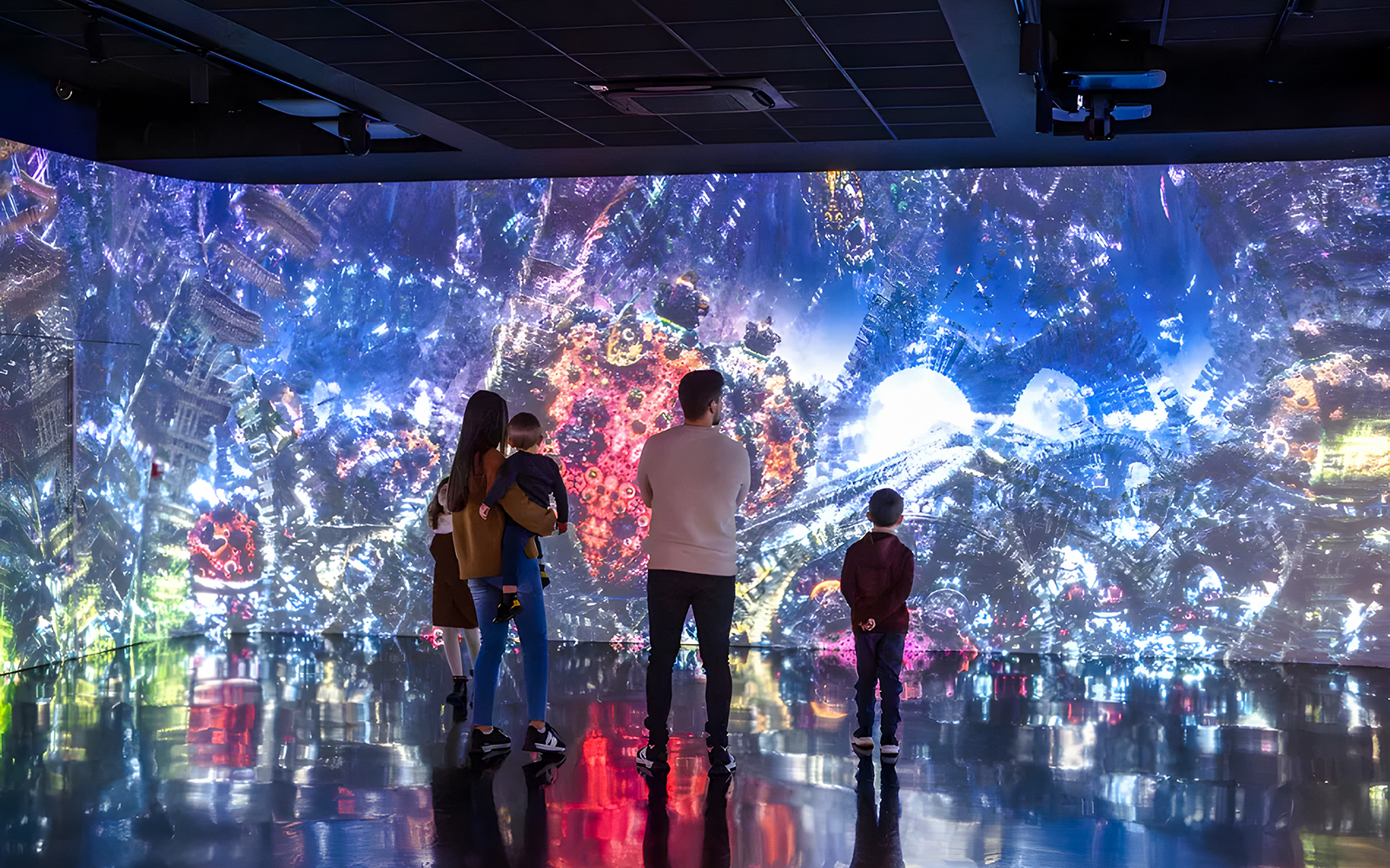 Immersive art installation at Fabrique des Lumières showcasing vibrant foreign nature scenes.