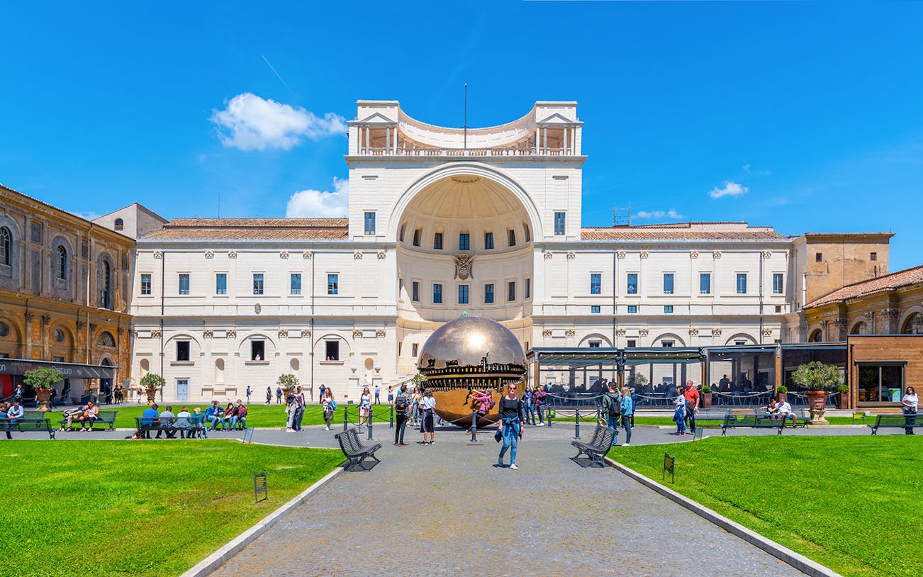 Courtyard of the Pigna in Vatican Museums with bronze sphere sculpture.