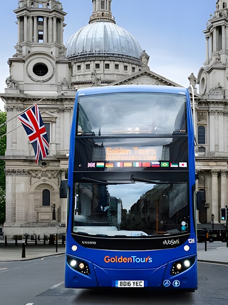 Open-top London tour bus in front of St. Paul's Cathedral.
