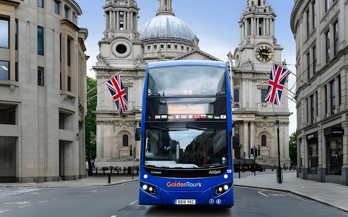 Open-top London tour bus in front of St. Paul's Cathedral.
