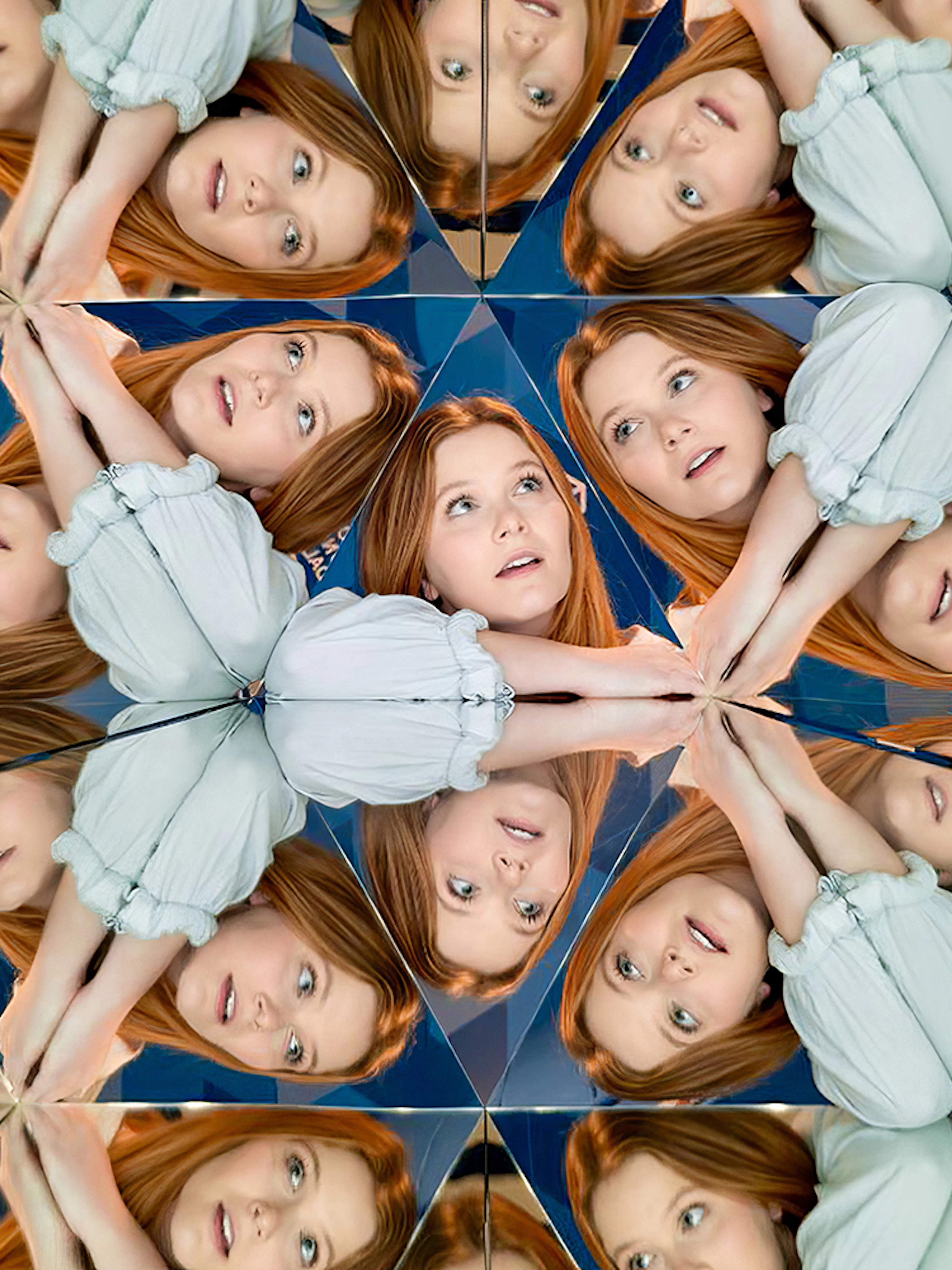Person reflected multiple times in mirrors at Museum of Illusions Dubai.