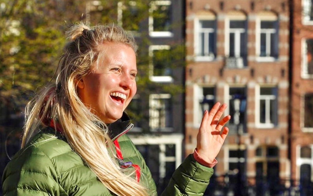 Tour guide in Amsterdam leading a cultural and historical walking tour.