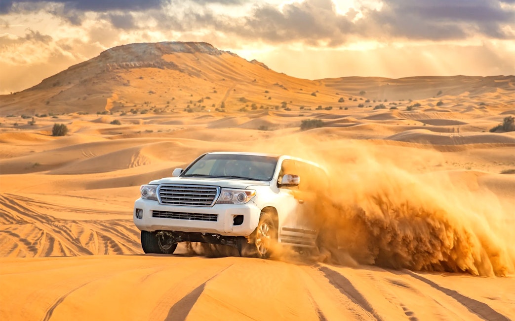4x4 vehicle dune bashing in the Dubai desert.