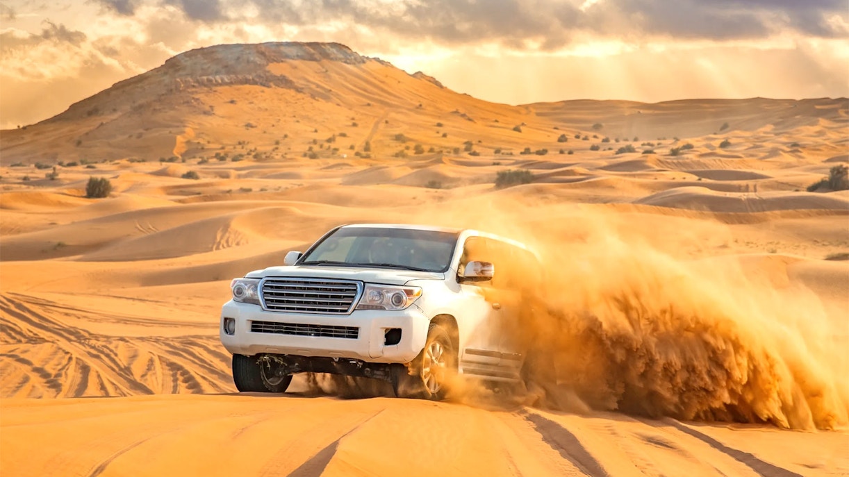4x4 vehicle dune bashing in the Dubai desert.